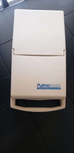 DeVilbiss PulmoMate 4650D Compressor/Nebulizer System in white with a built-in storage compartment