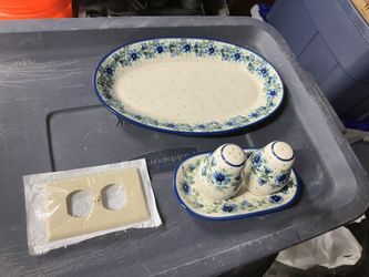 Polish Pottery (Bolesławiec) stoneware pieces.  The large item on the right is an oval platter or baker.  The items on the left are a salt and pepper 
