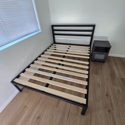 Full size metal bedframe with wooden slates