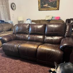Brown leather reclining sofa and love seat set