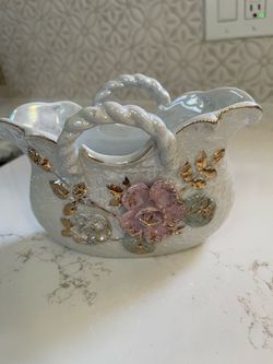 vintage mid-century Japanese porcelain trinket basket planter. It features a classic glossy white finish, a