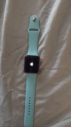 Apple Watch with Teal Sport Band