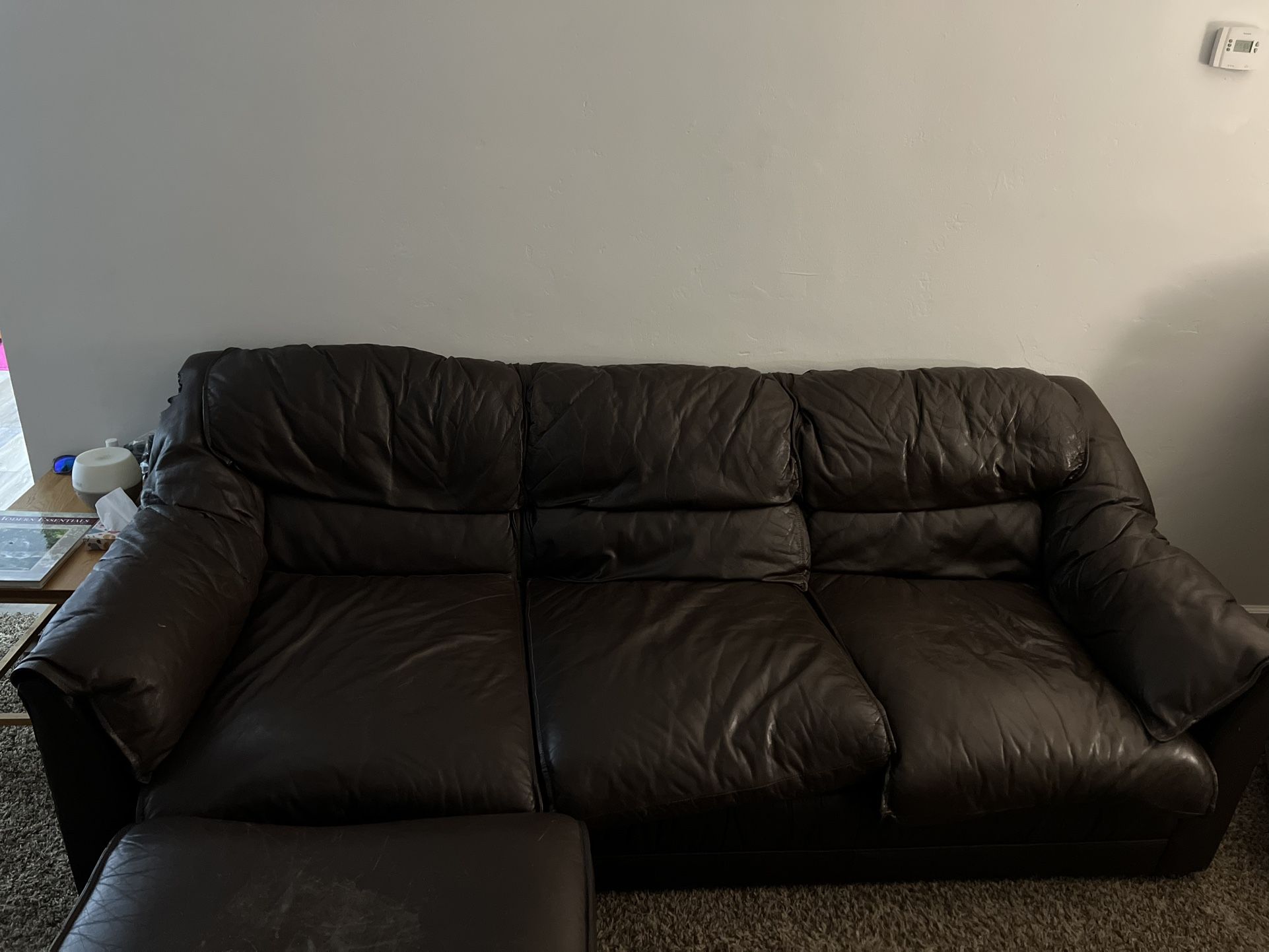 Brown Leather Couch And Arm Chair With Ottoman