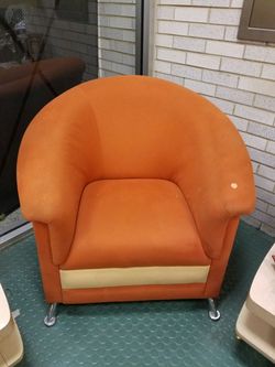 Retro mid-century modern Atomic orange and cream color club chair