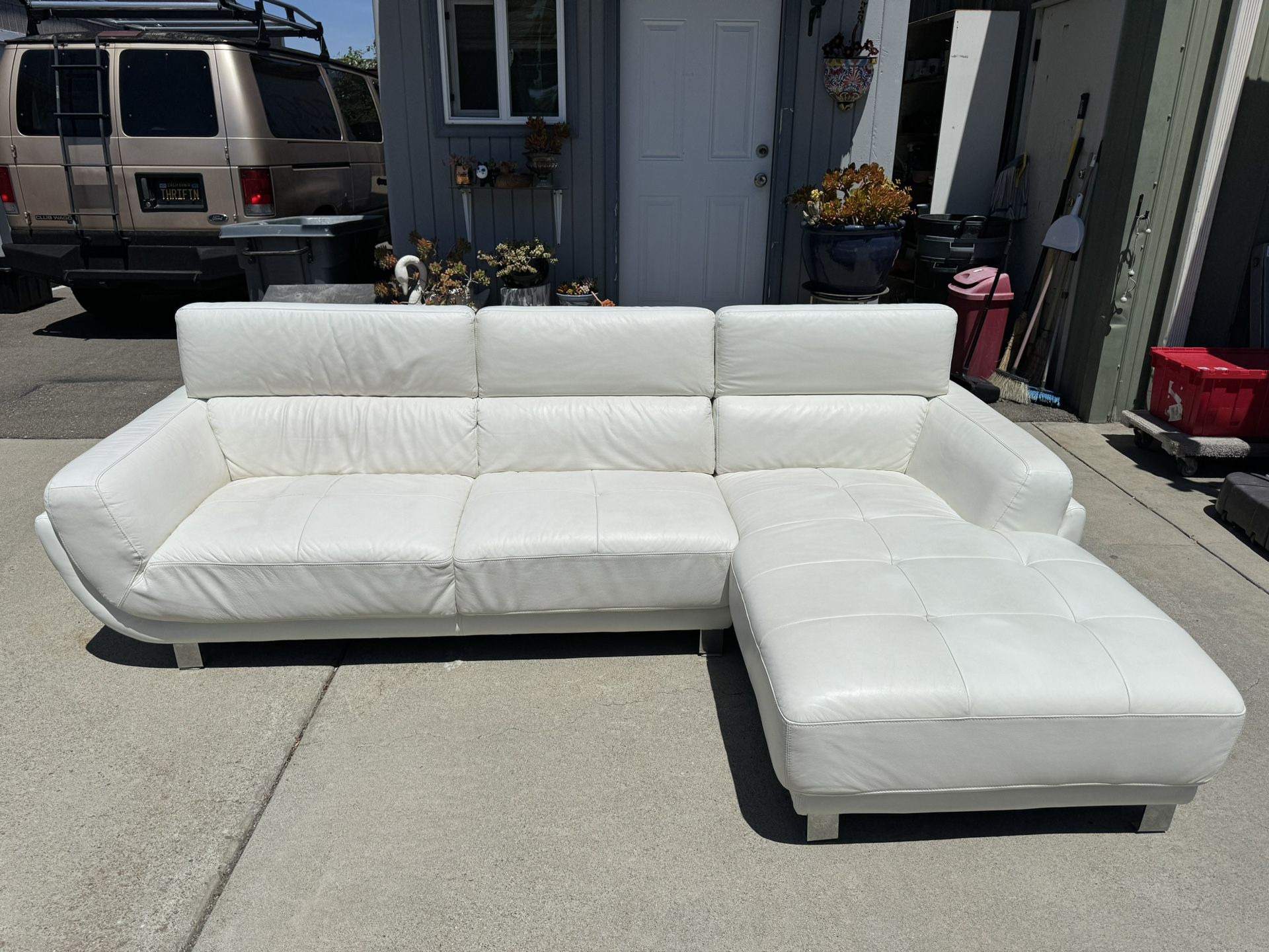 Nice Used  White Leather Sectional With Adjustable Headrests (With Minor Damage)