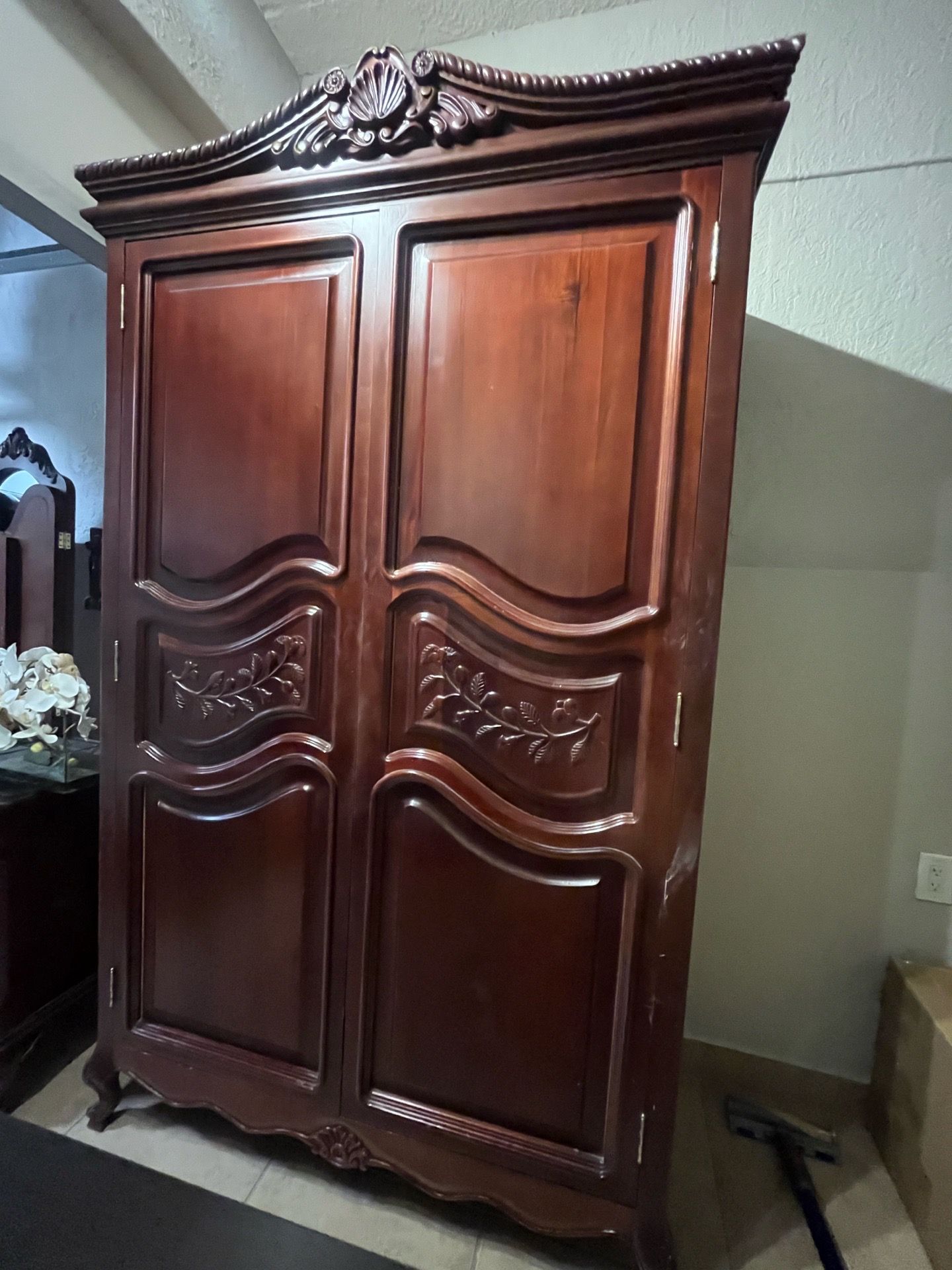 Beautiful large vintage armoire / entertainment cabinet with elegant carved detailing and rich dark cherry wood finish.