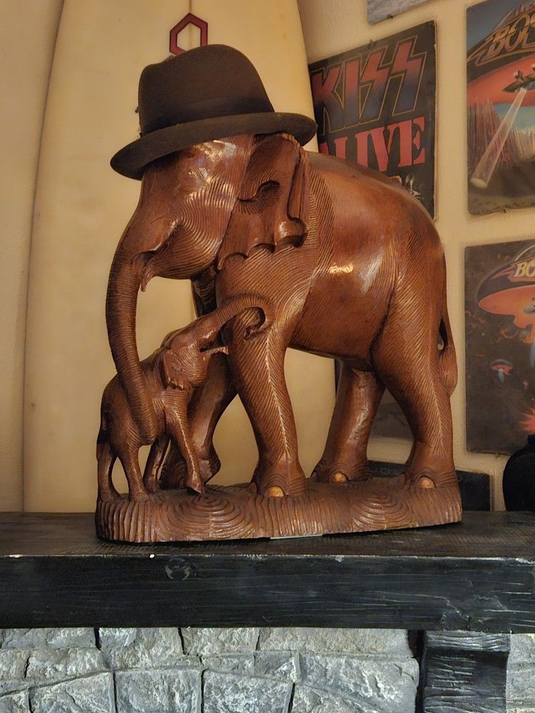 Teak elephants, 22 inches tall. 20 inches long.
