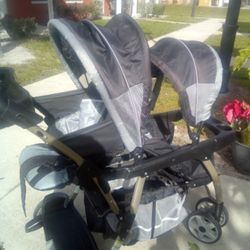 DOUBLE STROLLER  GREY AND BLACK IN GREAT CONDITION.