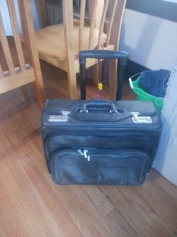 Letter traveler suitcase on wheels