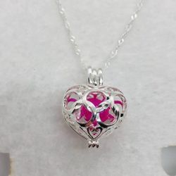 New Beautiful pink real rice Pearl in A Silver Heart Pearl Cage Charm with 20 inch Sterling Silver Chain. Makes a beautiful Valentine’s Day presen