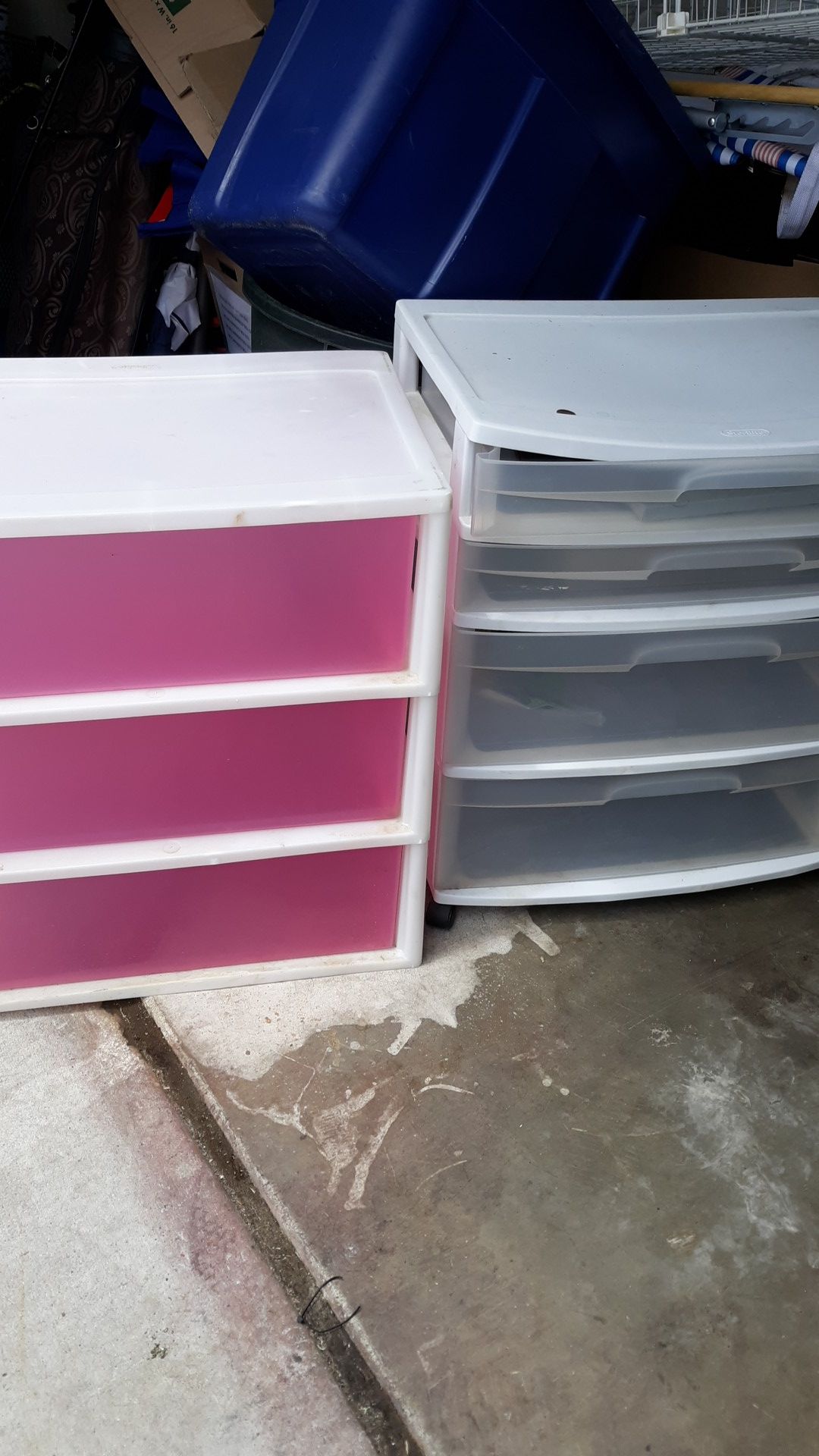 Plastic bins with drawers.