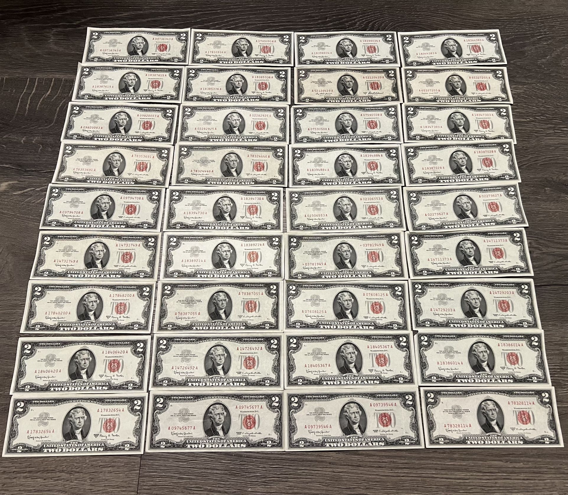 Rare lot of 66 $2 dollar bills red seal currency notes.