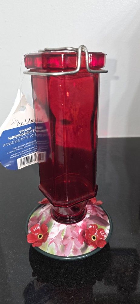 Red bottle hummingbird feeder