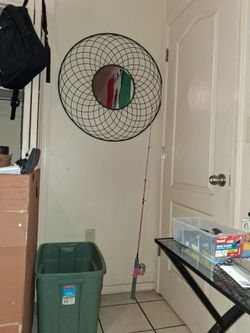 Fishing Pole and Large Metal Mirror