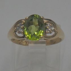 14kt yellow gold ring 3 grams with green stone & 6 small diamonds size 6.5.881855-1