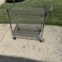 HEAVY DUTY INDUSTRIAL METAL CART IN GOOD CONDITION. IT MEASURES 18 DEEP,30 WIDE AND 33 HIGH. $75.00 OR BEST OFFER.