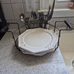 White Dinner Plates and Silverware In a Holder