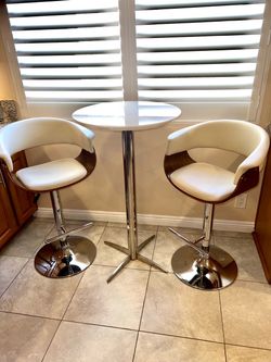 Table and two bar height chairs