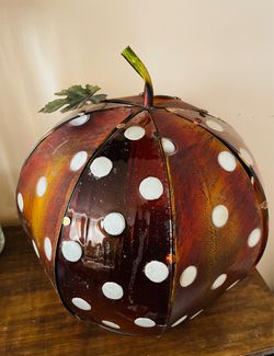 amber-brown polka-dot metal and glass pumpkin lantern