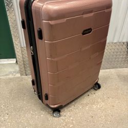 Large London fog luggage on four wheels. 28 “ high x 19 inch wide. $50