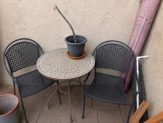 Patio rod iron table and chairs