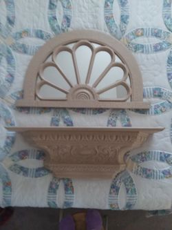 Mirror and wall shelf.