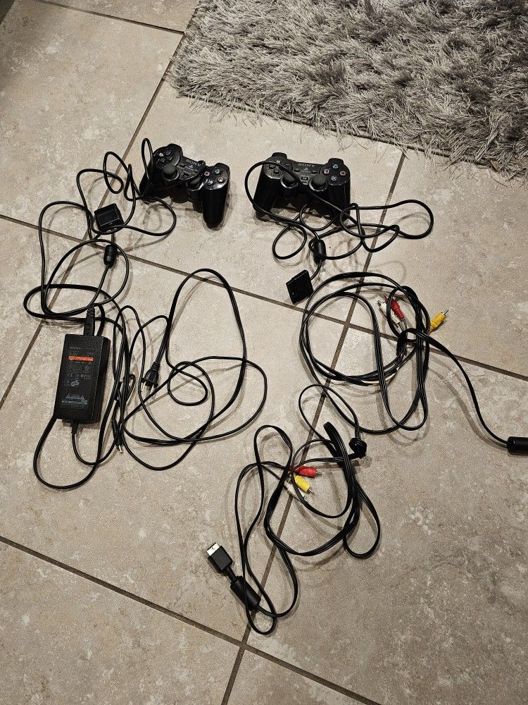 Ps2 power cord and 2 tv adapter cords plus 2 controllers