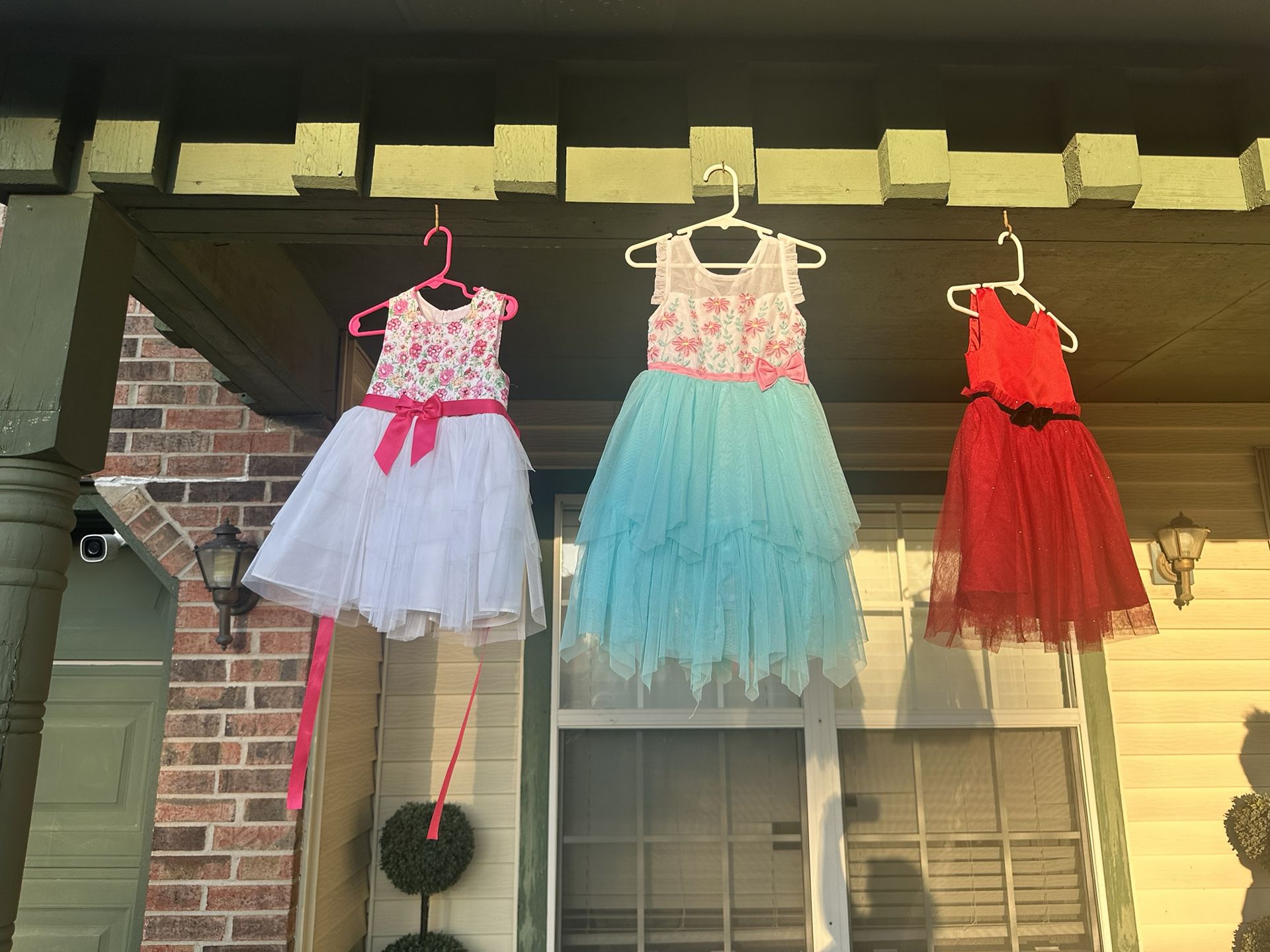 Several Dresses And Children’s Clothing Items