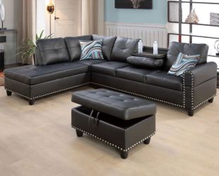 Black leather sectional couch and ottoman
