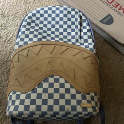 Spray ground backpack