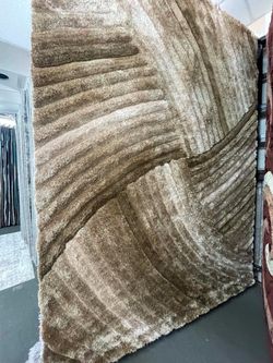 Brown Shaggy Area Rug with Wave Pattern
