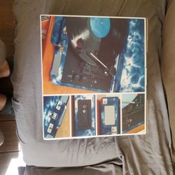 Portable Turn Table. Used 2 Times. Includes 4 Vinyl Records 