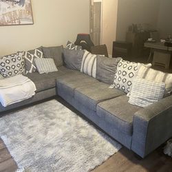 Light Green/ Grey Sectional Sofa With Pillows 