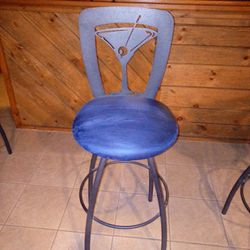 Metal swivel martini bar height stools with cloth seats