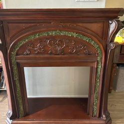 Beautiful wood fireplace frame with removable faux grass pattern