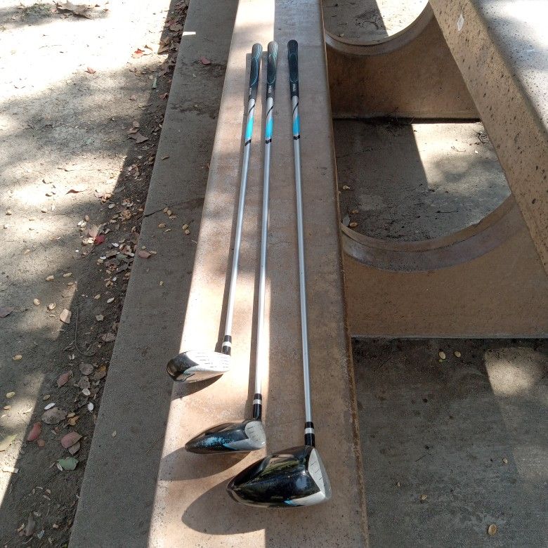 3 Strata Golf Clubs And 2 Sock Covers