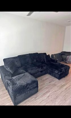 NEW BLACK RIBBED SECTIONAL W/ PULLOUT BED & DROP-DOWN TABLE – $1100