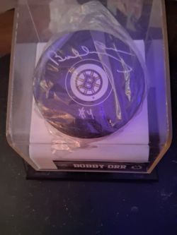 Autographed Bobby Orr number 4 puck in sealed case