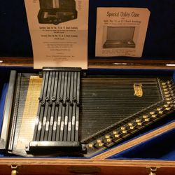 Oscar Schmidt  auto Harp Made  in the 40s or 1950s in excellent condition with carrying case asking 250