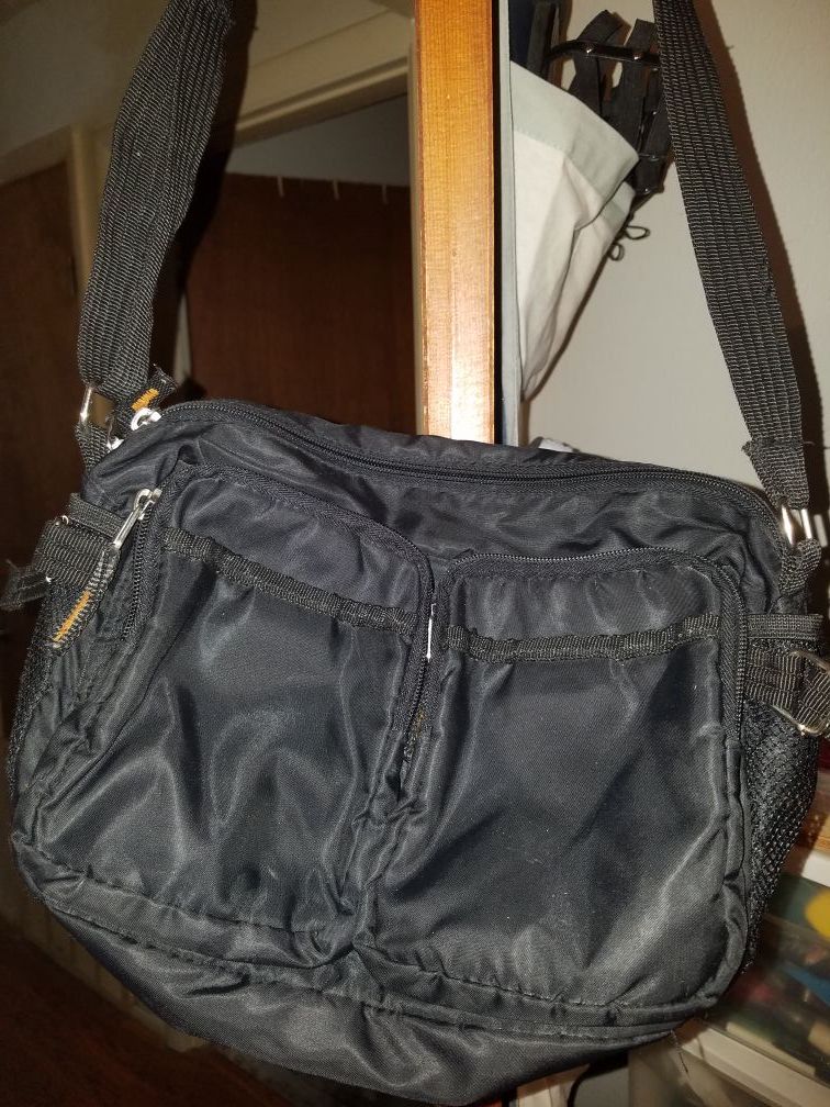 Nice Purse or Mini Laptop Bag. Big Zipper and 2 small zippers. Alot of room