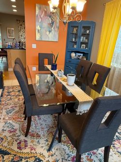 Glass dining table with 6 chairs
