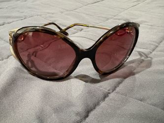 Betsey Johnson brown tortoise round sunglasses with metal bow frame