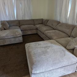 New 8 Piece Modular Sectional.  Grey Corduroy Fabric.  39”x120”x160”x39”.  Free Delivery!