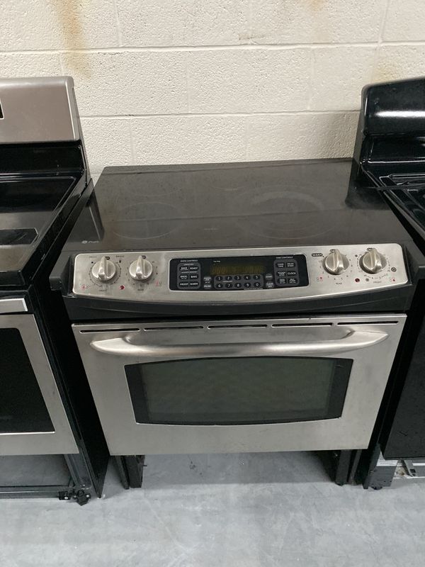 GE GLASS TOP SLIDE IN STOVE 4 month warranty for Sale in Charlotte, NC