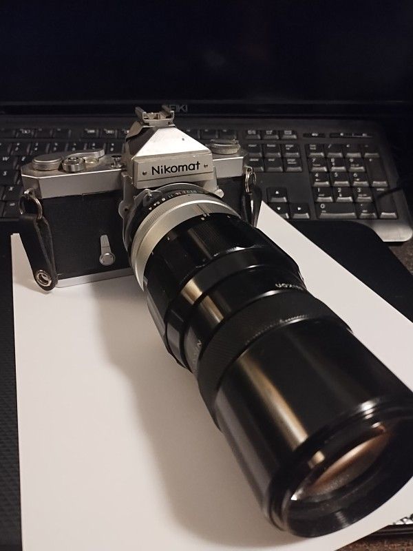 Nikkormat FT 35mm SLR Film Camera With 200mm Nikkor Lens shutter works well 