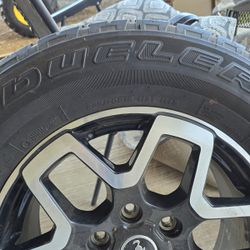 Tires Dueler 255/70R18 113T M+S  Brand new tires and wheels  From a 2025 Ford bronco  OBO.