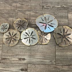 Metal sand-dollar wall art