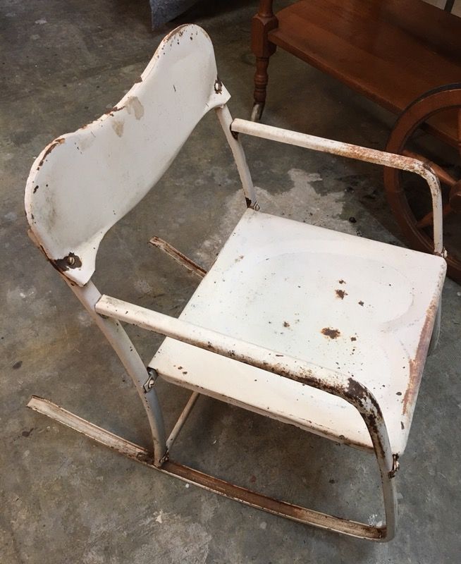 Antique child’s metal rocking chair