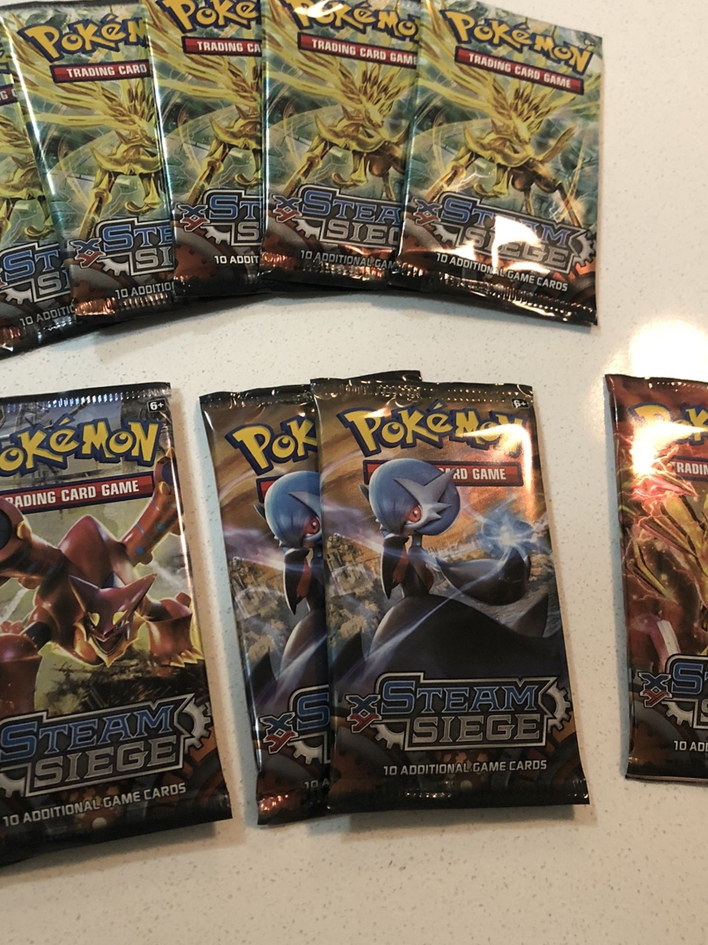 10 Packs Of XY Steam Siege Pokémon Cards