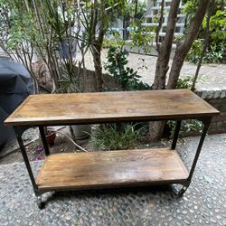 Industrial wooden and metal console shelf table on wheels